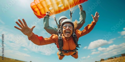 Skydiving. Tandem jump. Passenger is having fun.