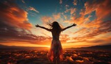 A woman is standing in a desert at sunset, with her arms outstretched