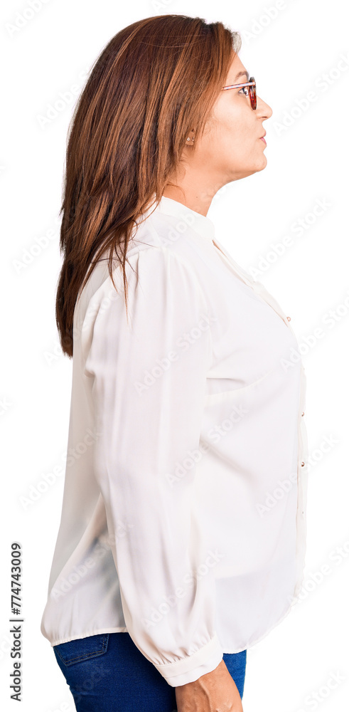 Middle age latin woman wearing casual clothes and glasses looking to side, relax profile pose with natural face with confident smile. Middle age latin woman wearing casual clothes and glasses looking to side, relax profile pose with natural face with confident smile.