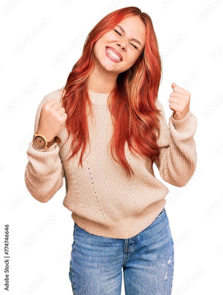 Φωτογραφία Young redhead woman wearing casual winter sweater very happy and excited doing winner gesture with arms raised, smiling and screaming for success