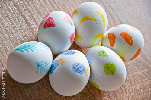 Good Friday. Hunting eggs. Painted eggs. Easter eggs on wooden table. Happy Easter holiday celebration. Easter bunny hunt. Spring holiday at Sunday. Eastertide and Eastertime. Golden Easter eggs photo