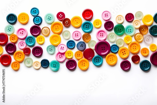 A cluster of assorted colorful buttons arranged in a pattern isolated on white solid background