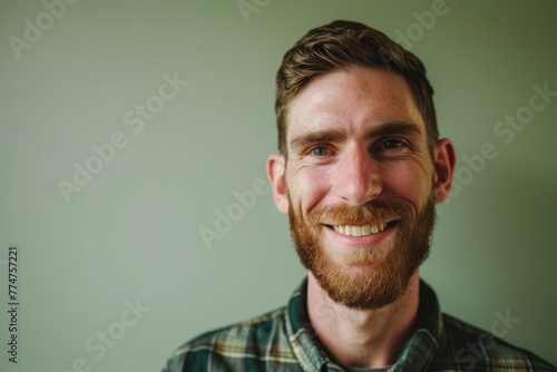 Portrait of a red-bearded man in a plaid shirt