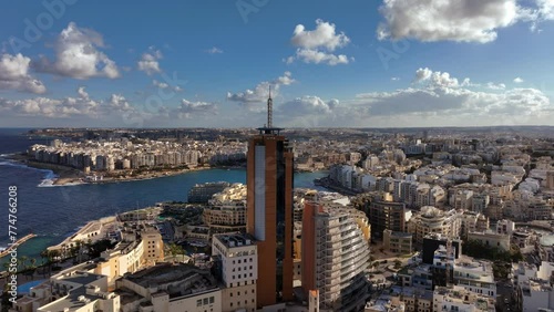 Aerial view of Portomaso Business Tower and St. Julians bay in the background. St. Julians City. Malta. photo