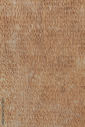 Ancient Roman legal inscriptions (text of Roman imperial law in Ancient Greek language) carved on stone, timeless epigraphic background for historical and educational content. Bodrum, Turkey photo