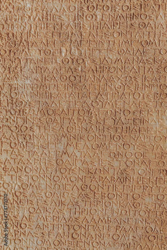 Obraz na płótnie Ancient Roman legal inscriptions (text of Roman imperial law in Ancient Greek language) carved on stone, timeless epigraphic background for historical and educational content