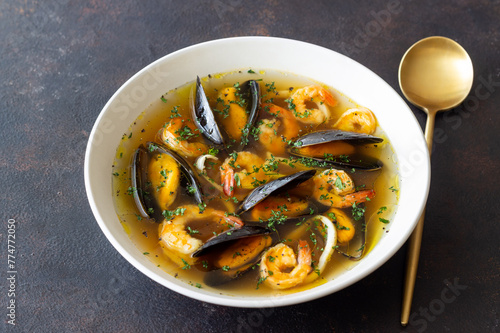 Soup with mussels, shrimps and squid. Healthy eating. Seafood.