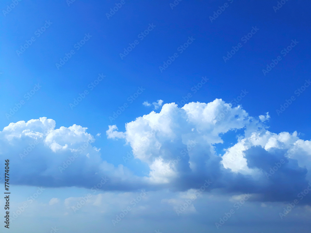 Bright blue sky clouds background in the daylight Bright blue sky clouds background in the daylight