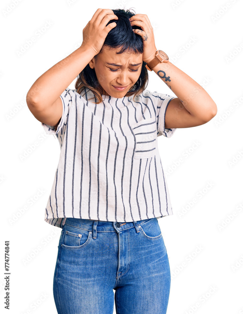 Young woman wearing casual clothes suffering from headache desperate and stressed because pain and migraine. hands on head. Young woman wearing casual clothes suffering from headache desperate and stressed because pain and migraine. hands on head.