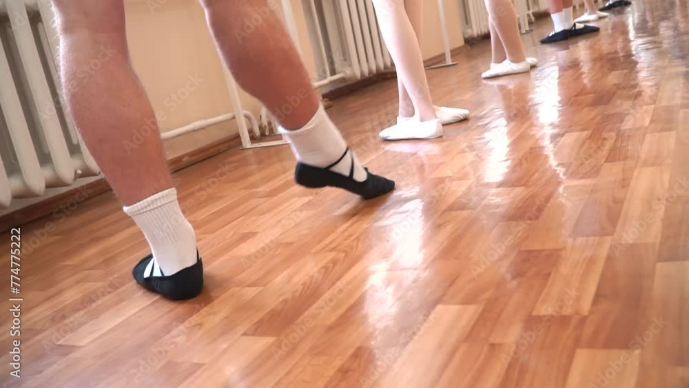 Male dancer's legs performing a dance on the floor Male dancer's legs performing a dance on the floor