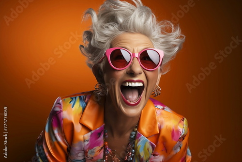 Funny happy blonde woman in pink sunglasses