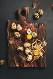 Quail eggs on a wooden board. Rustic style. Top view.
