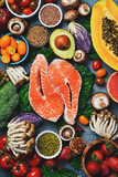 Top view, vertical photo. Healthy food clean eating selection. Superfood, fish and fruit.