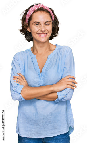 Young hispanic woman wearing casual clothes happy face smiling with crossed arms looking at the camera. positive person.