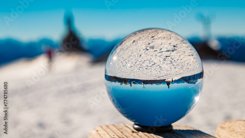 Crystal ball alpine winter landscape shot with a chapel at Mount Wallberg  Rottach-Egern  Lake Tegernsee  Miesbach  Bavaria  Germany