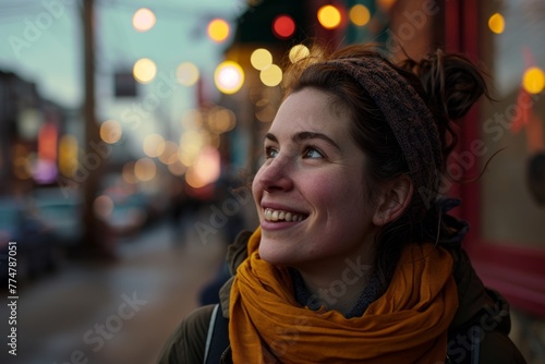 Portrait of a beautiful young woman in the city at Christmas time