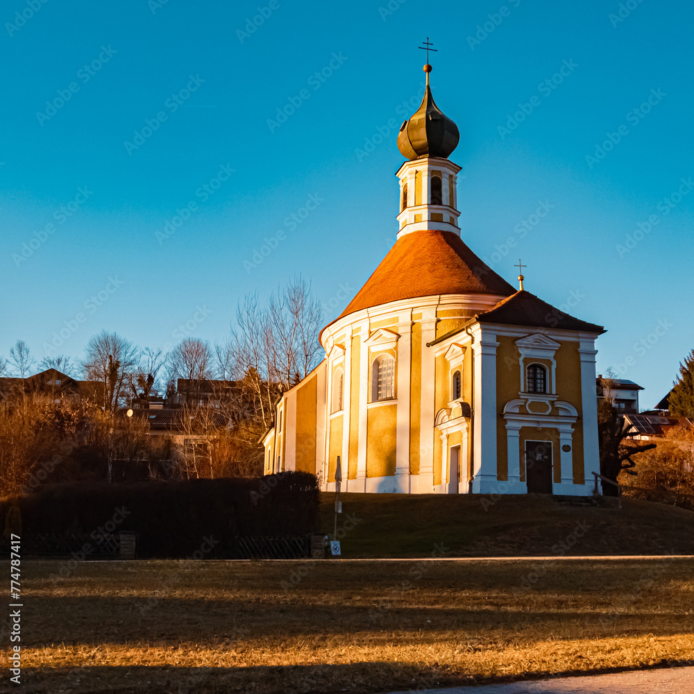 Naklejka premium Church on a sunny winter evening at Reischach, Altoetting, Bavaria, Germany