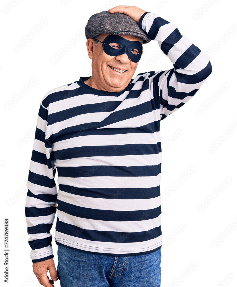 Senior handsome man wearing burglar mask and t-shirt smiling confident touching hair with hand up gesture, posing attractive and fashionable Senior handsome man wearing burglar mask and t-shirt smiling confident touching hair with hand up gesture, posing attractive and fashionable