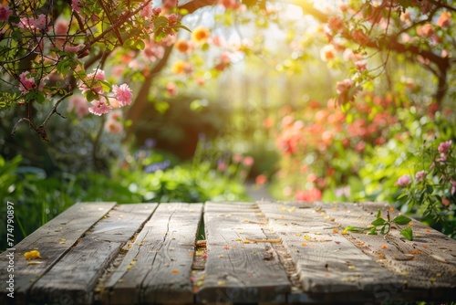 Wooden table in a blooming garden spring flowers photo