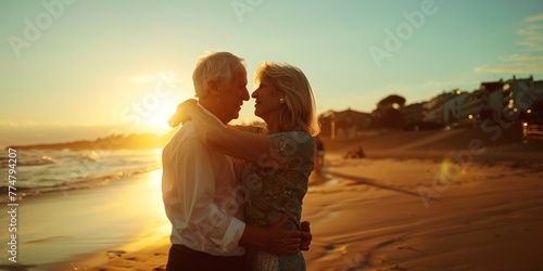 Elderly pair performing a dance on a sunny beach.
