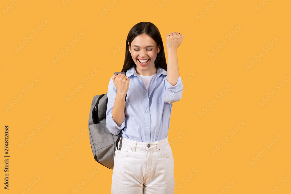 Happy young woman celebrating success, passed exam Happy young woman celebrating success, passed exam