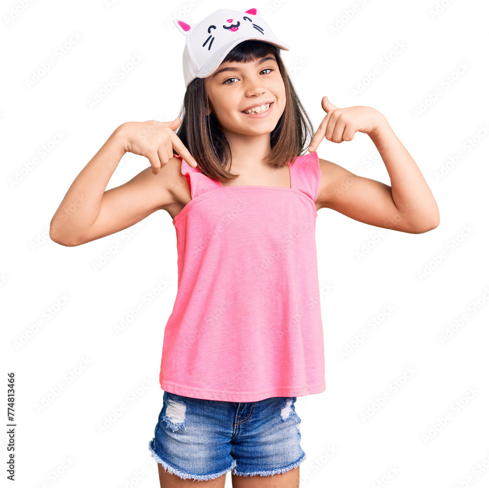 Young little girl with bang wearing funny kitty cap looking confident with smile on face, pointing oneself with fingers proud and happy. Young little girl with bang wearing funny kitty cap looking confident with smile on face, pointing oneself with fingers proud and happy.