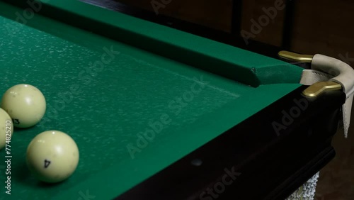 Wallpaper Mural Young men playing American billiard poule close-up. Colorful balls on green billiards table .Billiard balls with numbers on a pool table. Billiards team sport. Torontodigital.ca