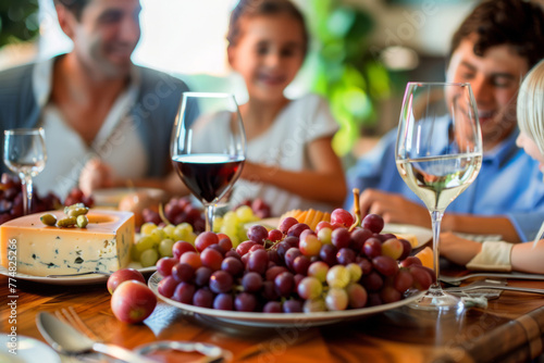 Friends together at the dinner table with cheese plate and grapes. Generative AI