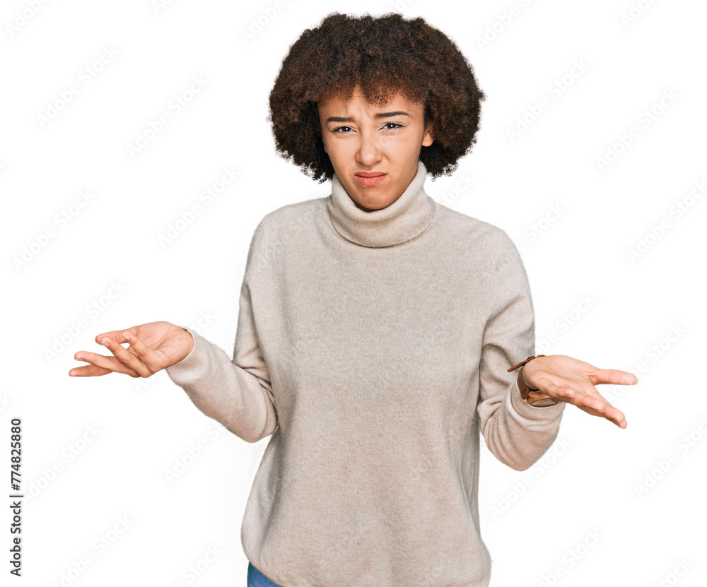 Young hispanic girl wearing wool winter sweater clueless and confused with open arms, no idea concept. Young hispanic girl wearing wool winter sweater clueless and confused with open arms, no idea concept.