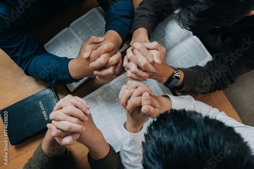 Obraz na plátně Group of christian people reading the Holy Bible to pray and worship God together in the sunday morning