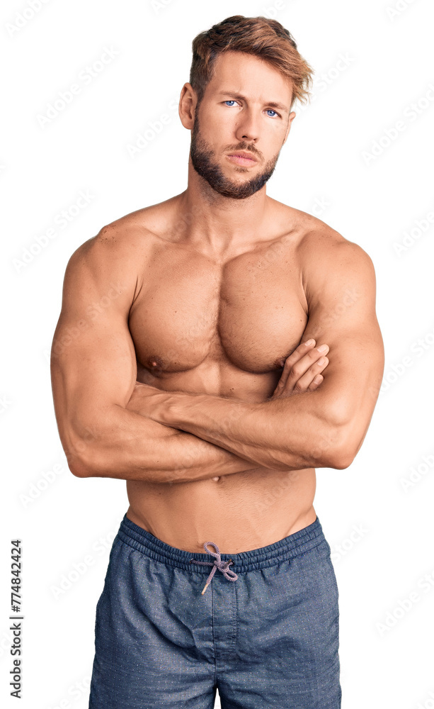 Young caucasian man standing shirtless skeptic and nervous, disapproving expression on face with crossed arms. negative person. Young caucasian man standing shirtless skeptic and nervous, disapproving expression on face with crossed arms. negative person.