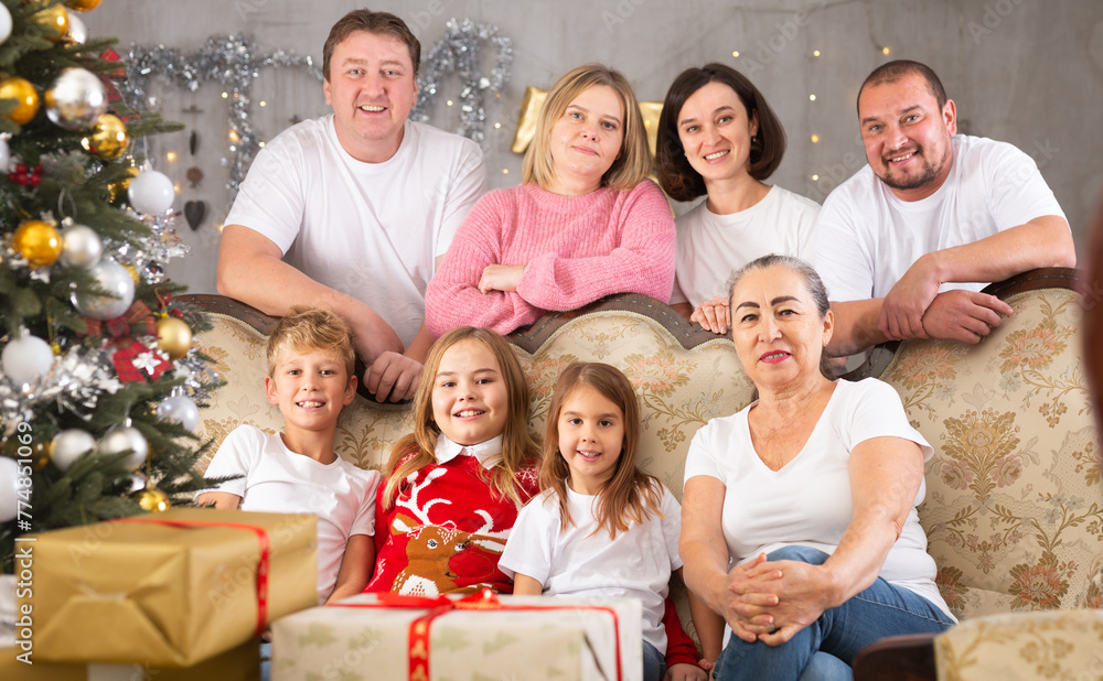 Family with children on sofa in christmas interior Family with children on sofa in christmas interior