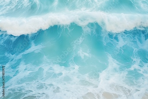 Blue ocean waves with foam, summer background, top view. photo