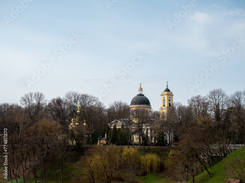 Domes of the Orthodox Cathedral among the trees of the city park