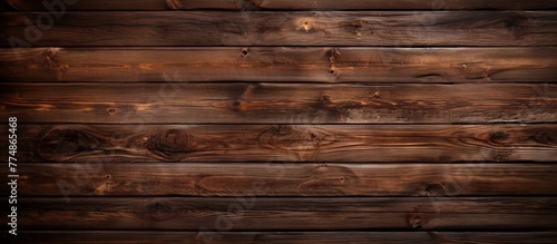 Detailed view of a wooden wall surface shown closely, contrasted against a dark background