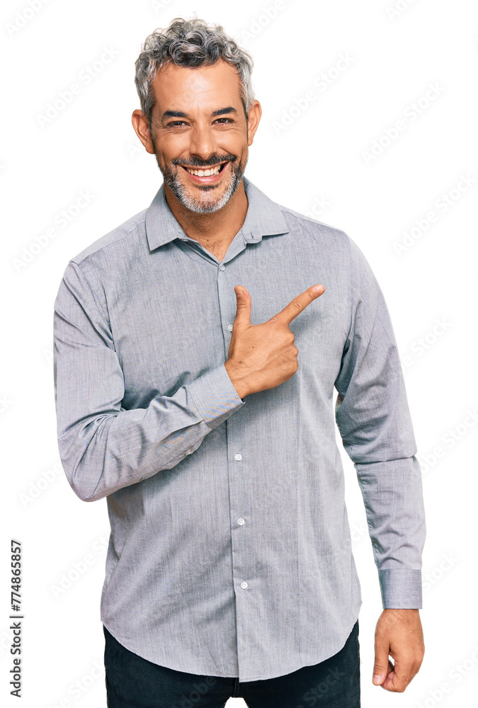 Naklejka premium Middle age grey-haired man wearing casual clothes cheerful with a smile of face pointing with hand and finger up to the side with happy and natural expression on face