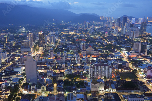 A view of the cityscape of Penang in Malaysia during the blue hour of the day.