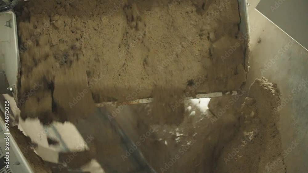 Pouring crushed sand Pouring crushed sand