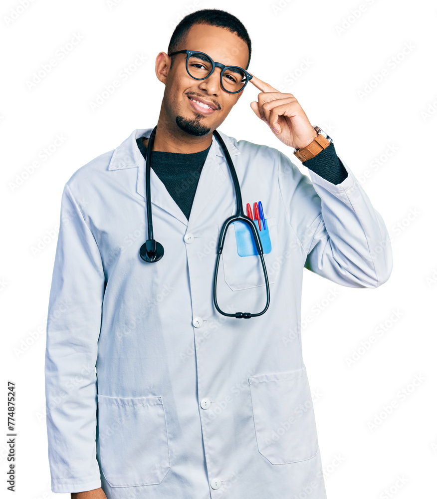 Young african american man wearing doctor uniform and stethoscope smiling pointing to head with one finger, great idea or thought, good memory Young african american man wearing doctor uniform and stethoscope smiling pointing to head with one finger, great idea or thought, good memory