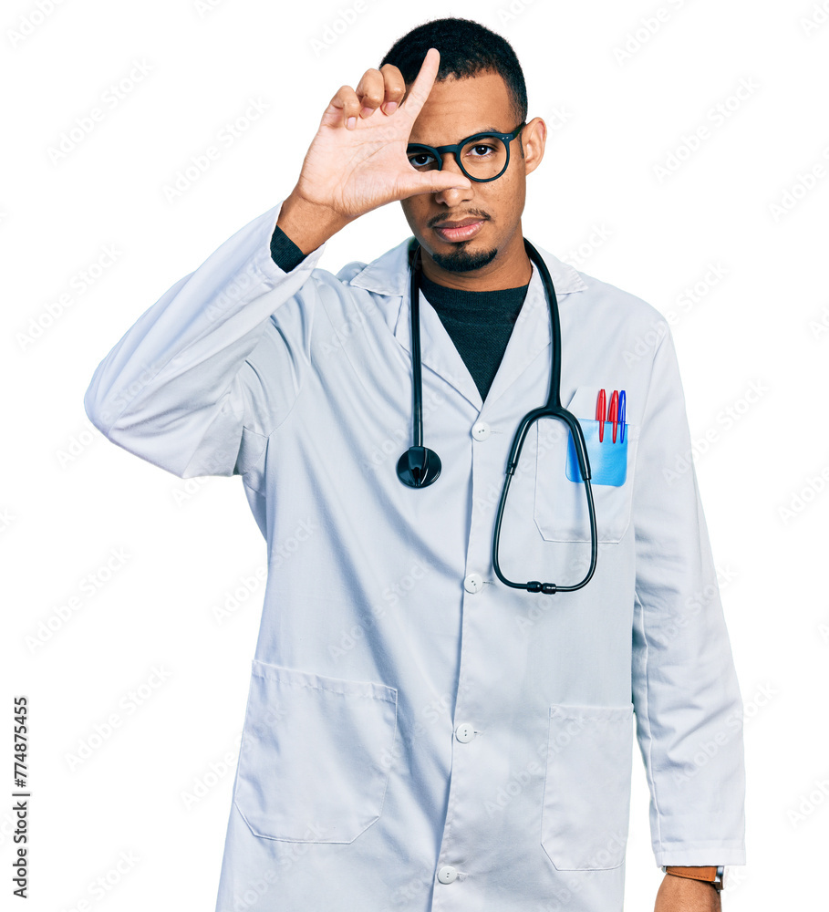 Young african american man wearing doctor uniform and stethoscope making fun of people with fingers on forehead doing loser gesture mocking and insulting. Young african american man wearing doctor uniform and stethoscope making fun of people with fingers on forehead doing loser gesture mocking and insulting.