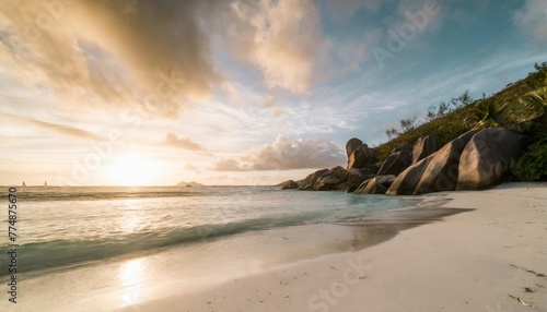 sunset at anse source d argent beach la digue seychelles photo