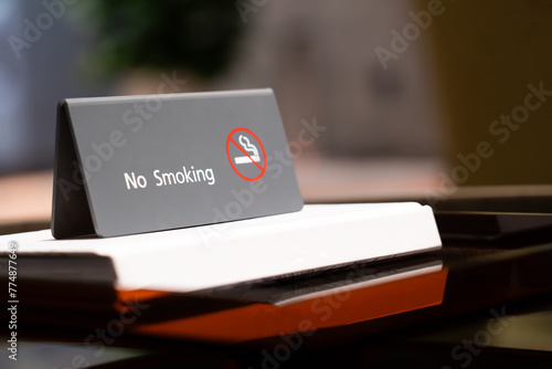 No smoking sign on table in hotel room