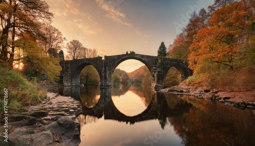 arch bridge in kromlau saxony germany colorful autumn in germany rakotz bridge in kromlau photo