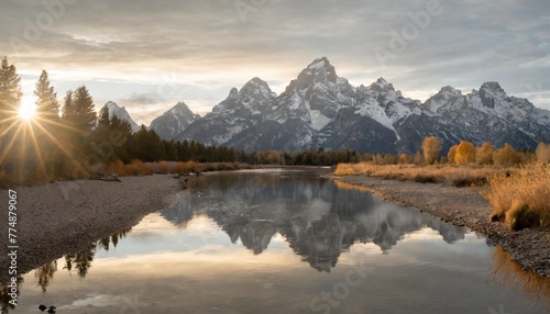 reflections of the tetons in the snake river in grand teton national park © Claudio