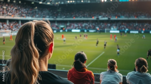 Women watching a professional women's soccer game from the stands
