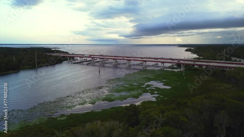 Wallpaper Mural Drone of Lake Monroe and I4 Bridge with vehicles at sunset with cloudy sky in Sanford, Florida Torontodigital.ca