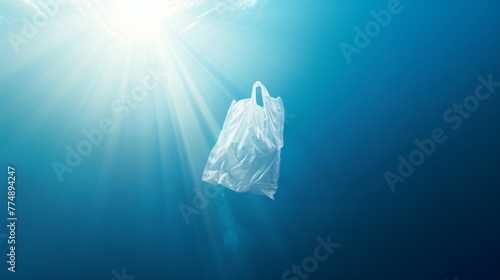 Plastic bag floating in the ocean, an environmental problem photo