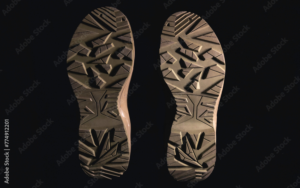 Bottom of shoes, isolated on black background. Bottom of shoes, isolated on black background.