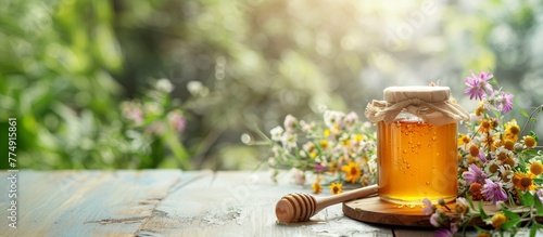 A banner with a jar of honey and flowers on a wooden table. Horizontal photo background with copy space.