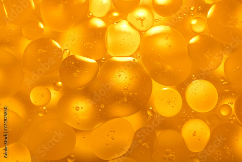 Oil background on water It has a beautiful golden color.